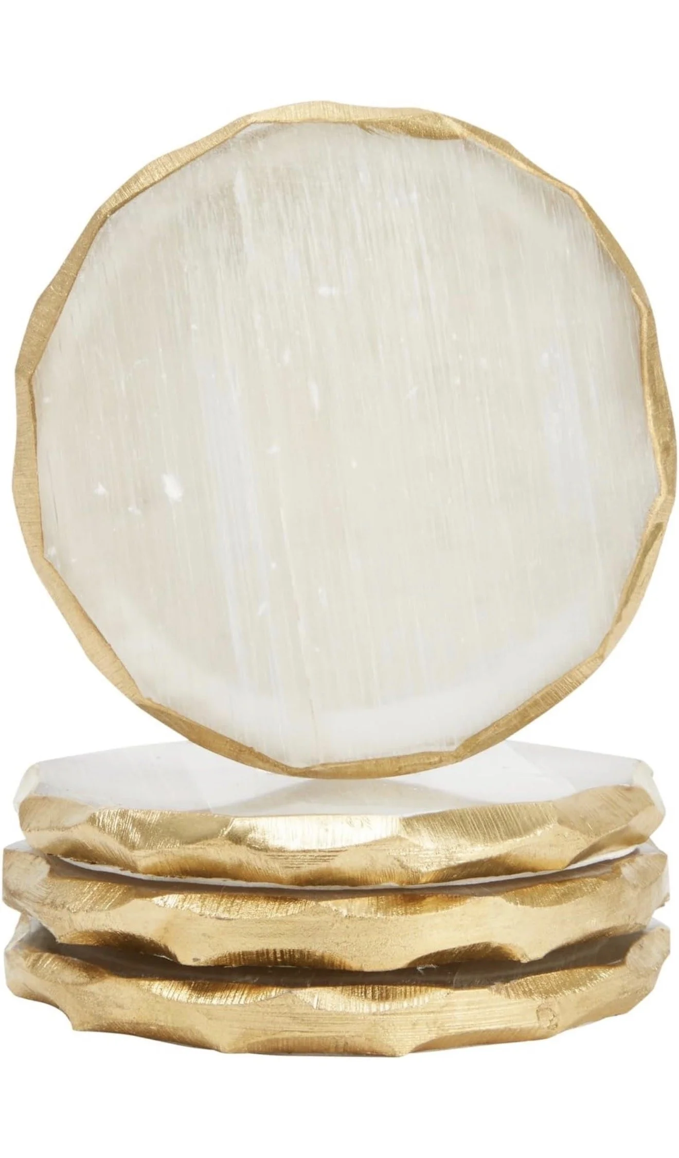 Set of four white and gold stone drink coasters. Elegant round stone coasters with a white marble-style center and gold trim. Perfect for protecting surfaces while adding a chic, neutral touch to coffee tables, dining rooms, and home bars.