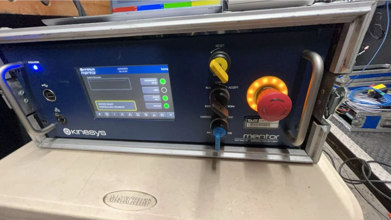 Medical or industrial control device with a digital display, warning lights, and various buttons and switches.