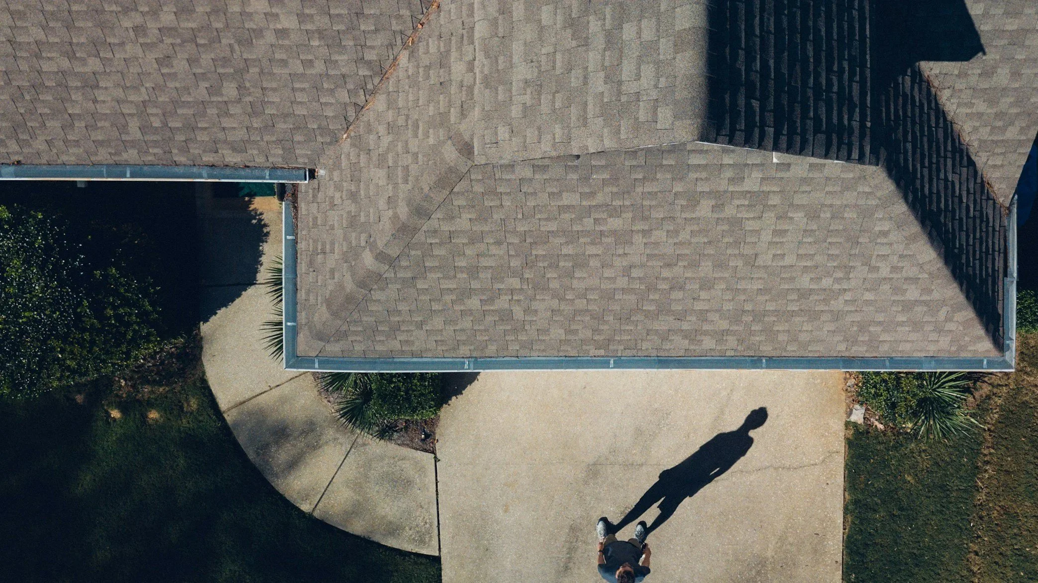 Person using a circular saw to cut wood in a workshop.