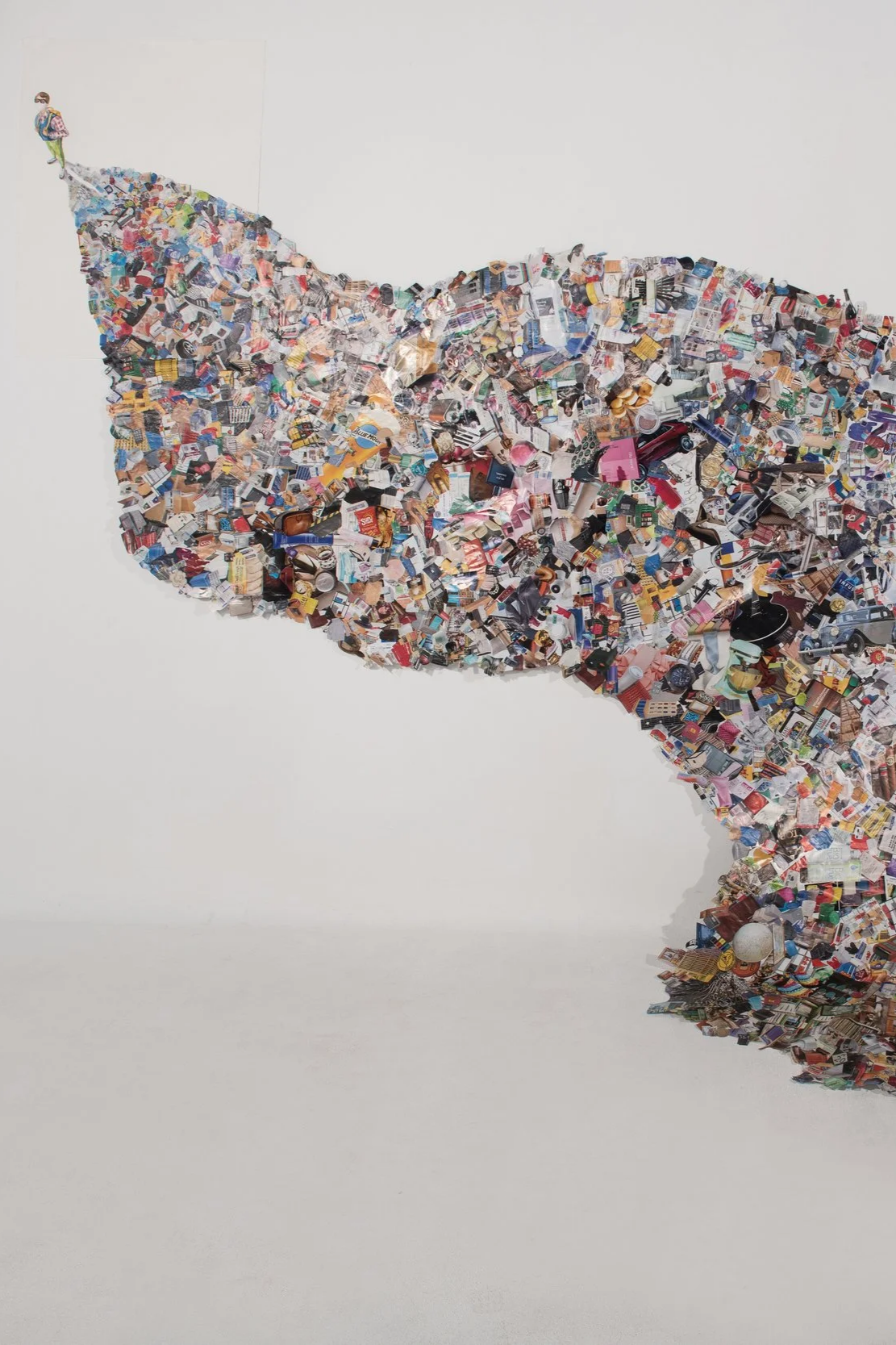 Nathan Y. — Through collage and self-portraiture, this work visualizes the hidden impact of modern consumption. The shadow becomes a record of what is accumulated, discarded, and left behind.