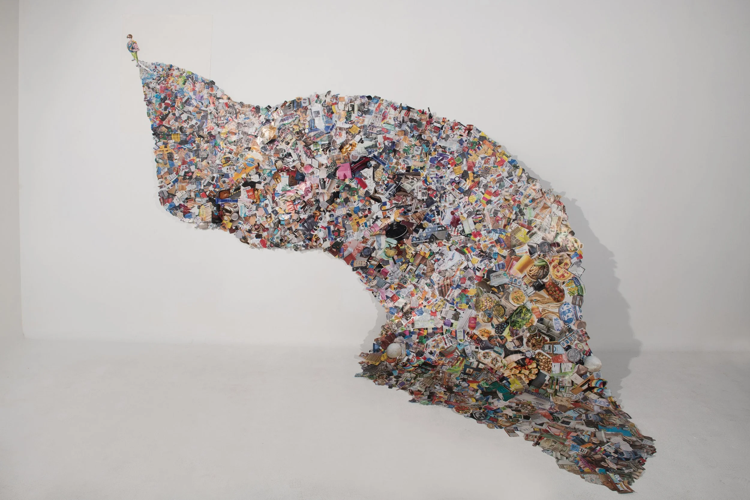 Nathan Y. — Through collage and self-portraiture, this work visualizes the hidden impact of modern consumption. The shadow becomes a record of what is accumulated, discarded, and left behind.