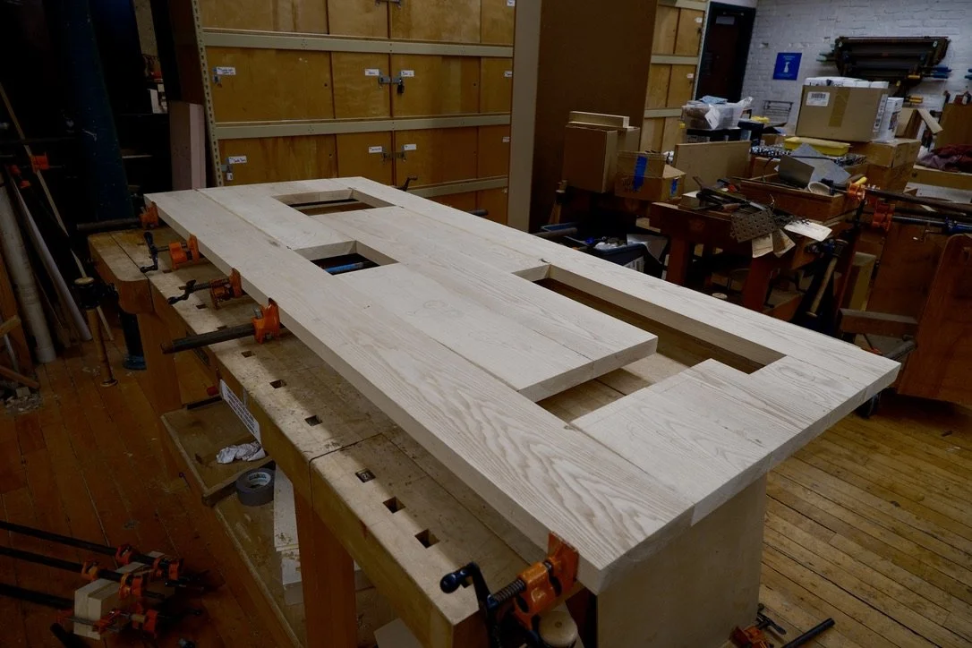 Tabletop with cavities to fit table legs and "butcher block" protrusions.