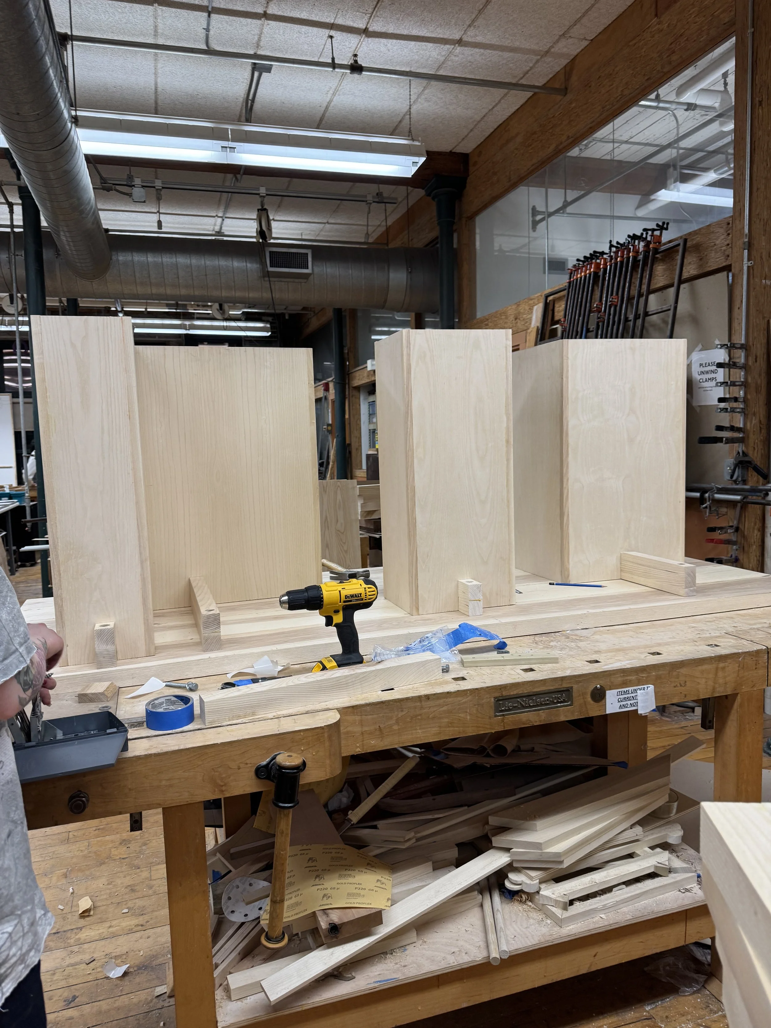 Laying out corresponding attachment points to align the tabletop with the apron assembly.