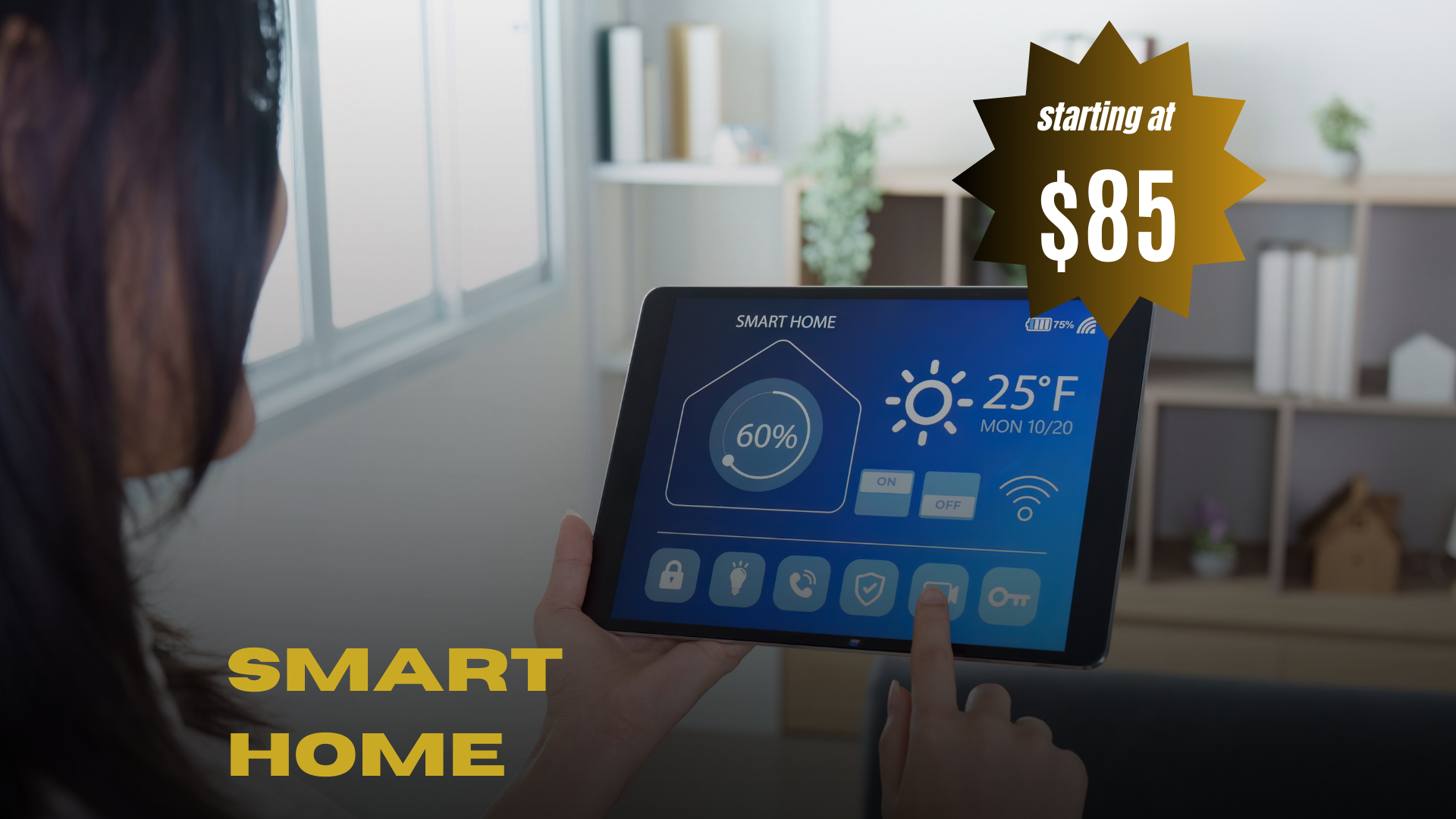 A person operating a smart home control tablet in a well-lit room with a monitor displaying temperature, battery life, and smart home controls. A promotional label indicates the smart home system starts at $85.
