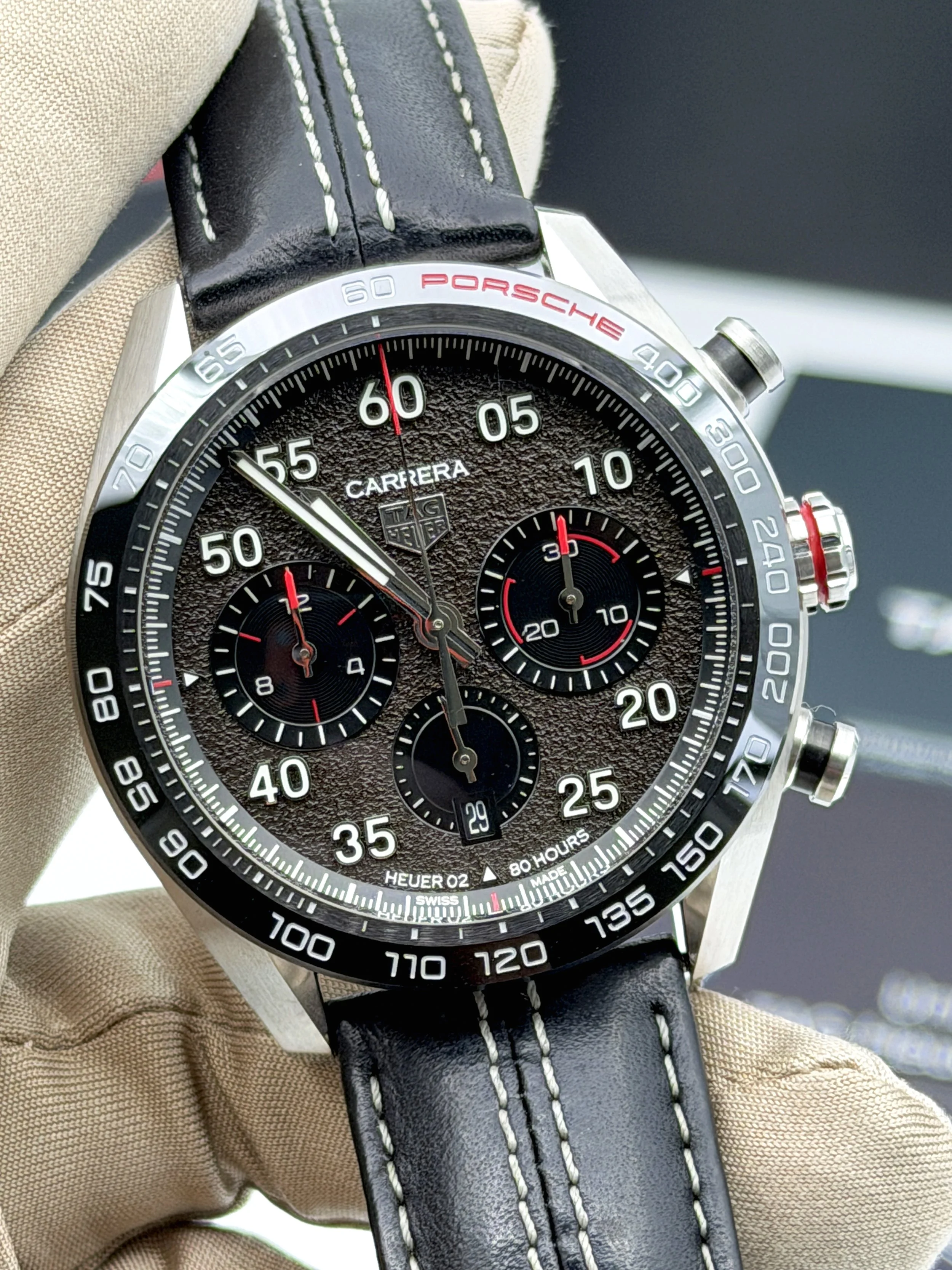 Tag Heuer Carrera Chronograph x Porsche stainless steel watch with black asphalt-style dial and red accents