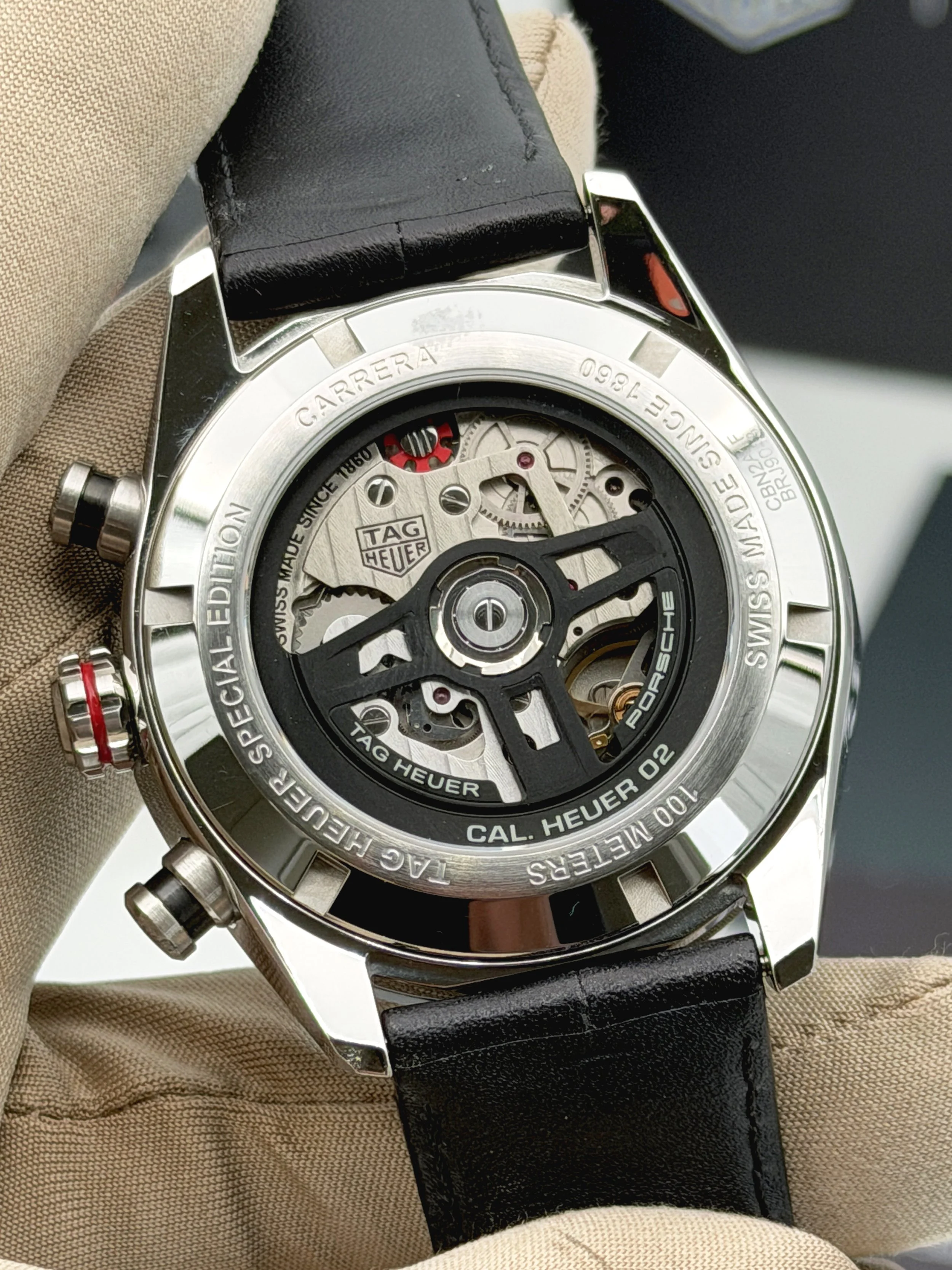 Tag Heuer Carrera Chronograph x Porsche stainless steel watch with black asphalt-style dial and red accents