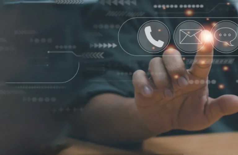 Person touching a virtual screen with icons for phone, email, and chat messages