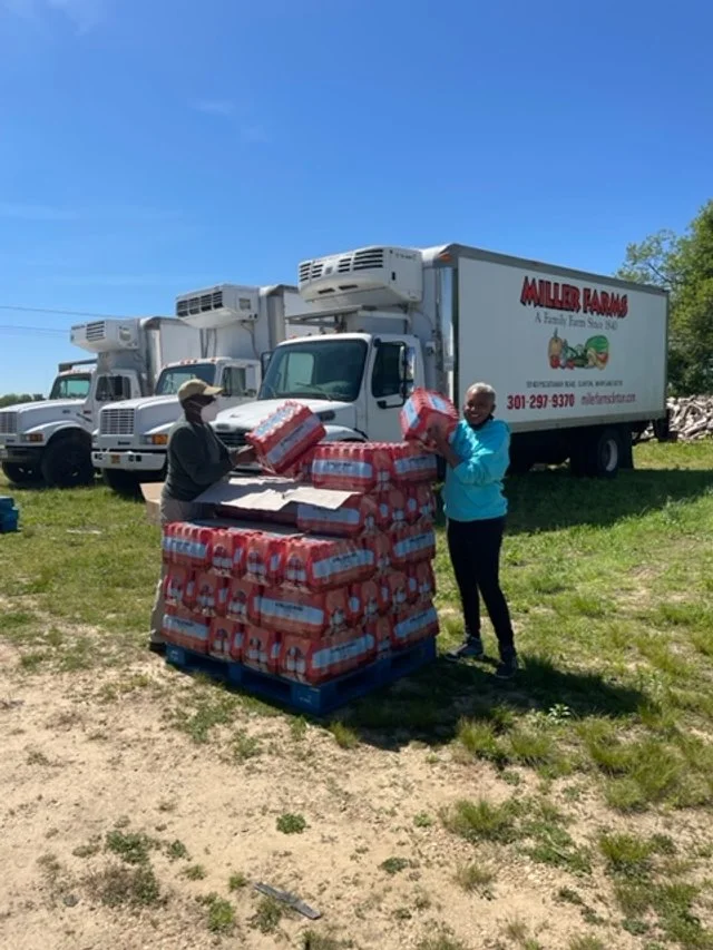Lolita E Walker - Pallet of Drinks for Community.jpg