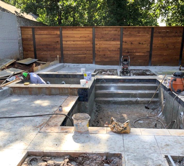 Under construction swimming pool with surrounding decking and tools Good Earth Pools, Oklahoma. 