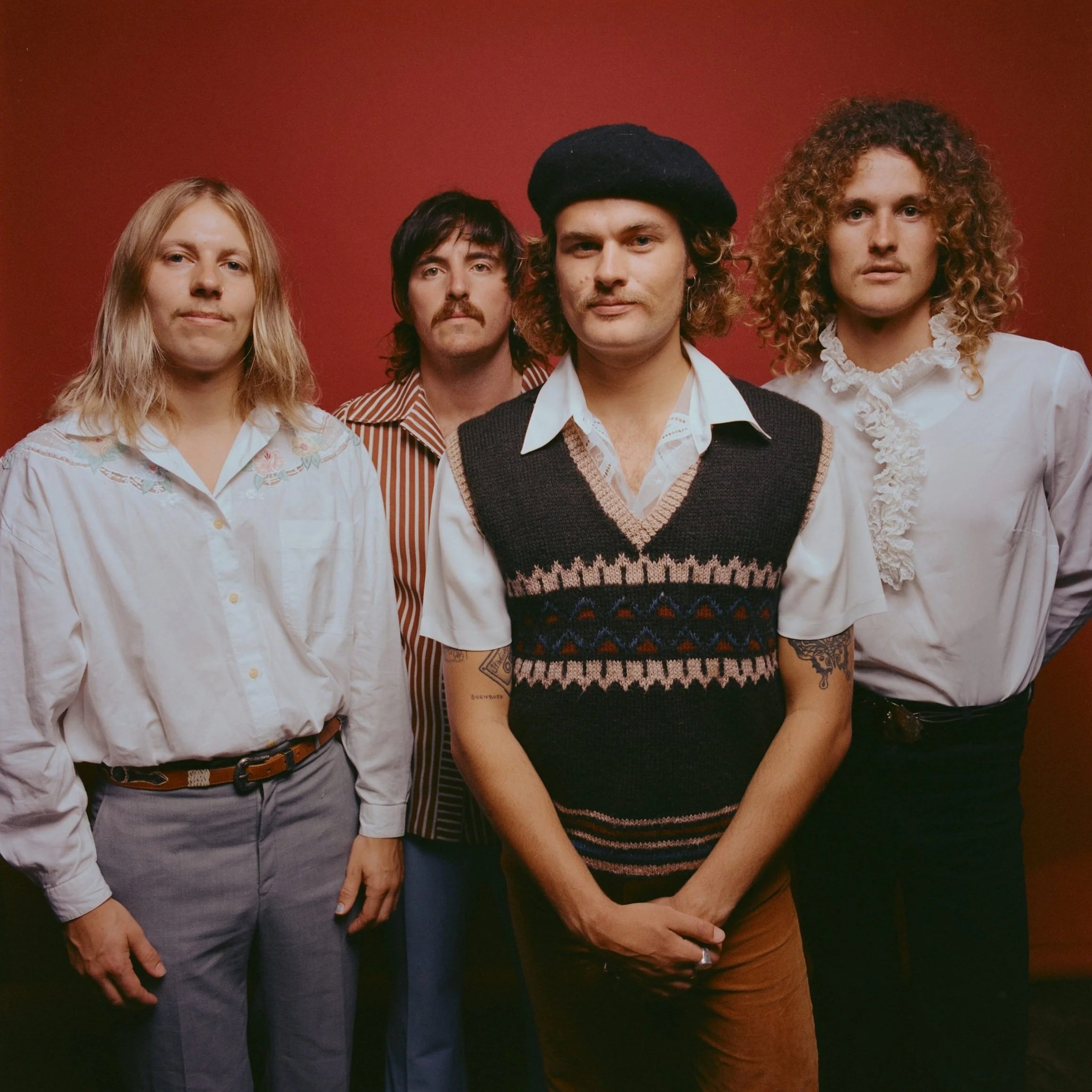 Pacific Avenue album cover of four men standing against a red background.