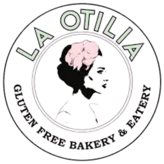 Logotipo de La Otilla, una panadería y cafetería, con una ilustración de una mujer con cabello rizado y un sombrero, y texto en inglés y español alrededor.
