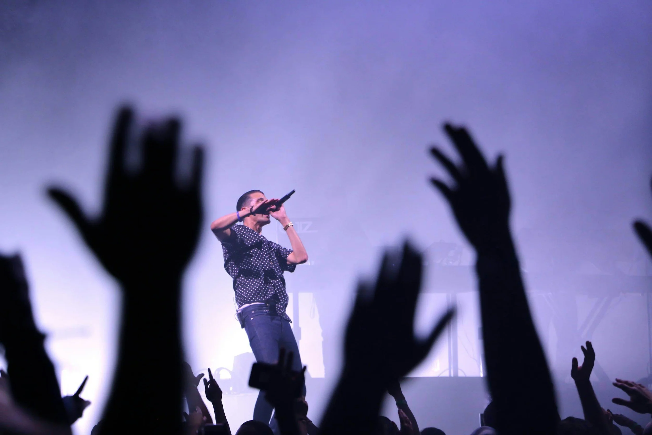 Independent musician on stage during a live performance on tour