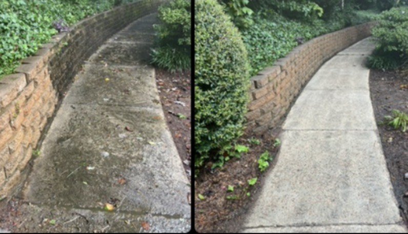 Side-by-side comparison of a concrete sidewalk before and after cleaning and repair, with a brick wall on the left side and green bushes on the right side.