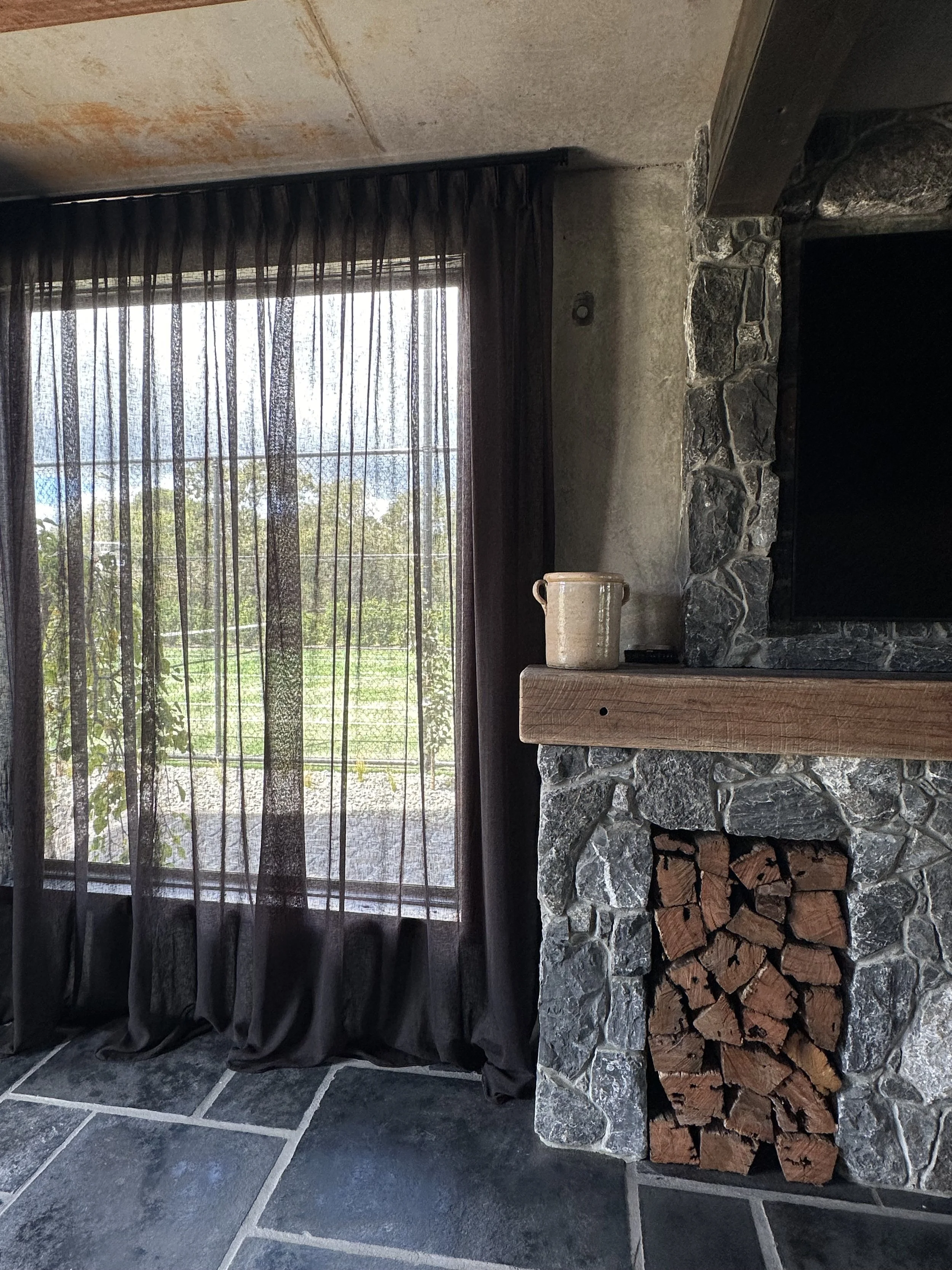 Beautiful black sheers in a modern rustic barn home.