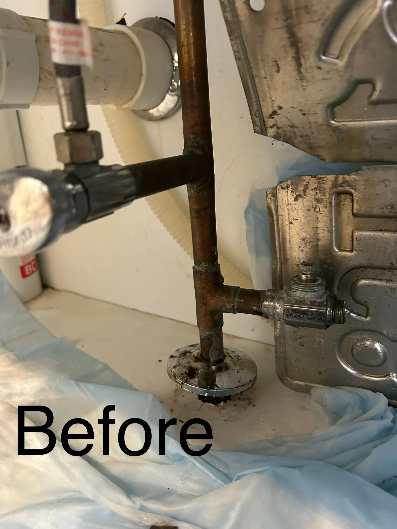 Rusty plumbing pipe with a valve and other plumbing components, labeled 'Before'.