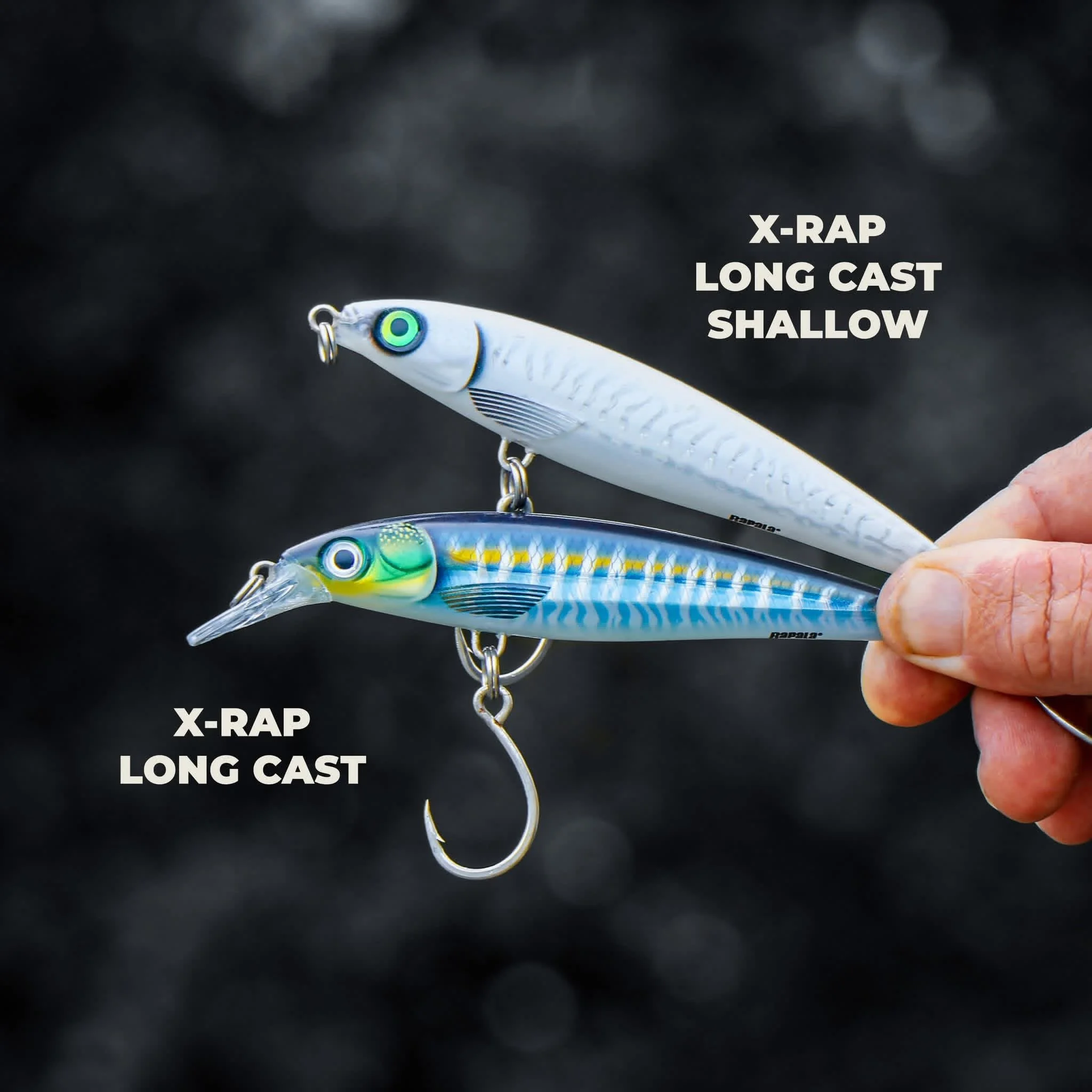 Two fishing lures, one white and one blue, are held in a person's hand against a dark background. The white lure is labeled as 'X-RAP LONG CAST SHALLOW' and the blue lure as 'X-RAP LONG CAST'.