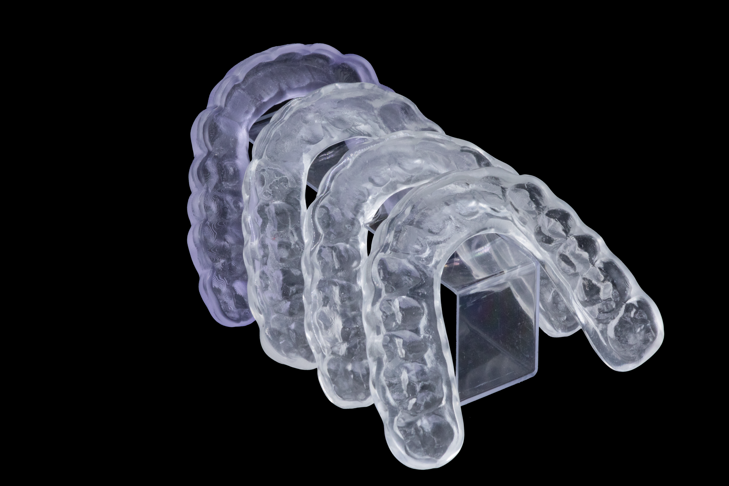 Four 3D Printed Night Guards In A Row.png
