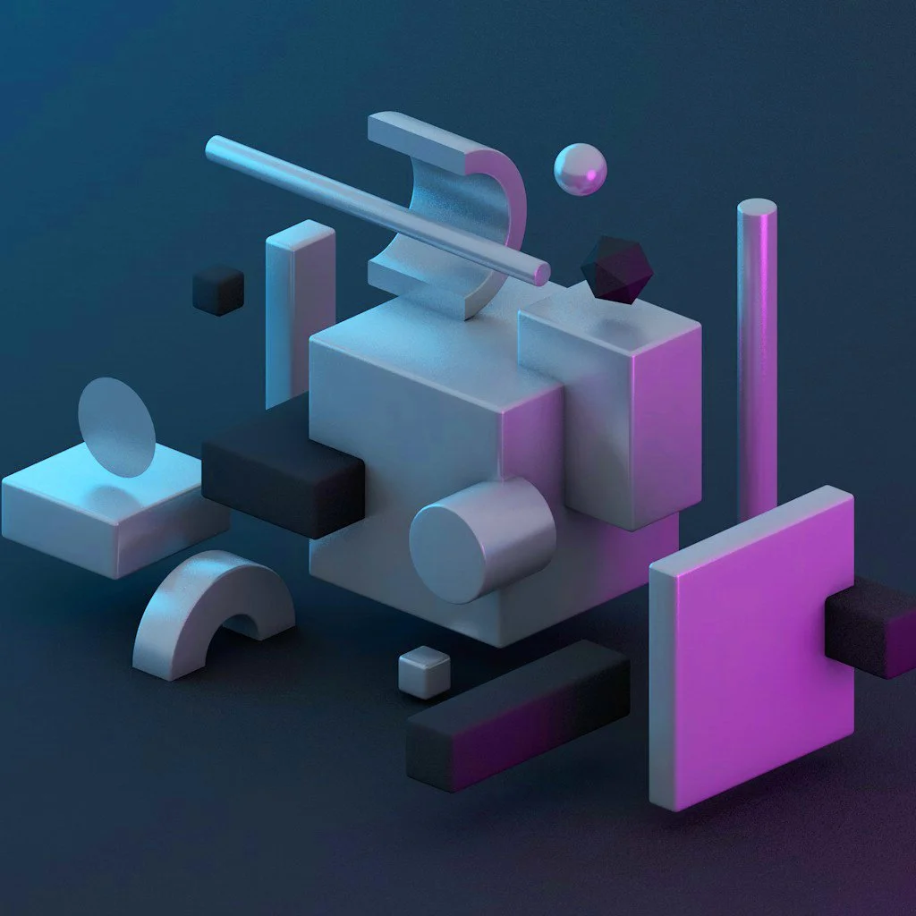 Abstract 3D geometric shapes in blue, pink, black, and white on a dark background.