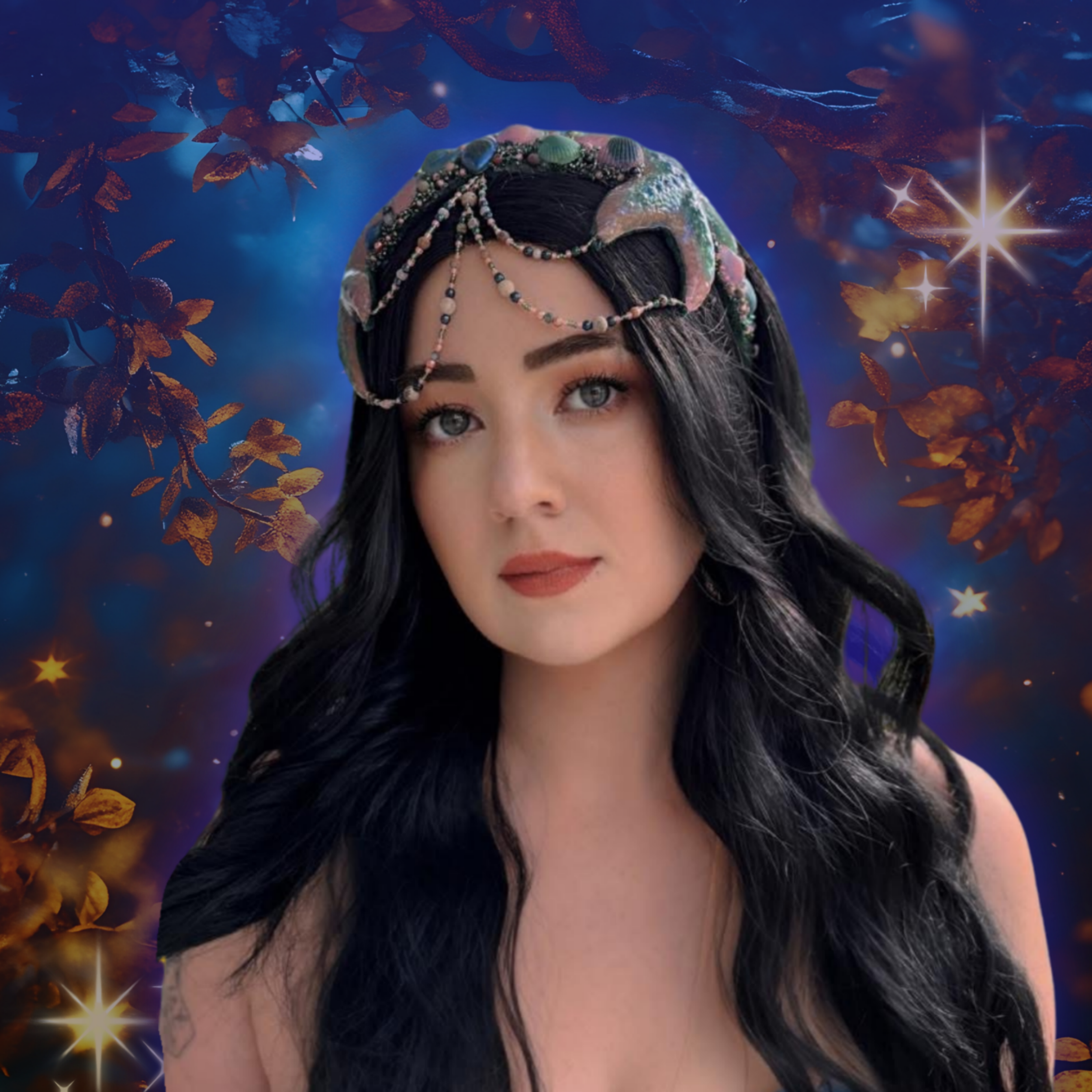 A woman with long black hair, light skin, and blue eyes, wearing an elaborate headpiece decorated with shells and beads, against a fantasy-style background of glowing stars and orange leaves.