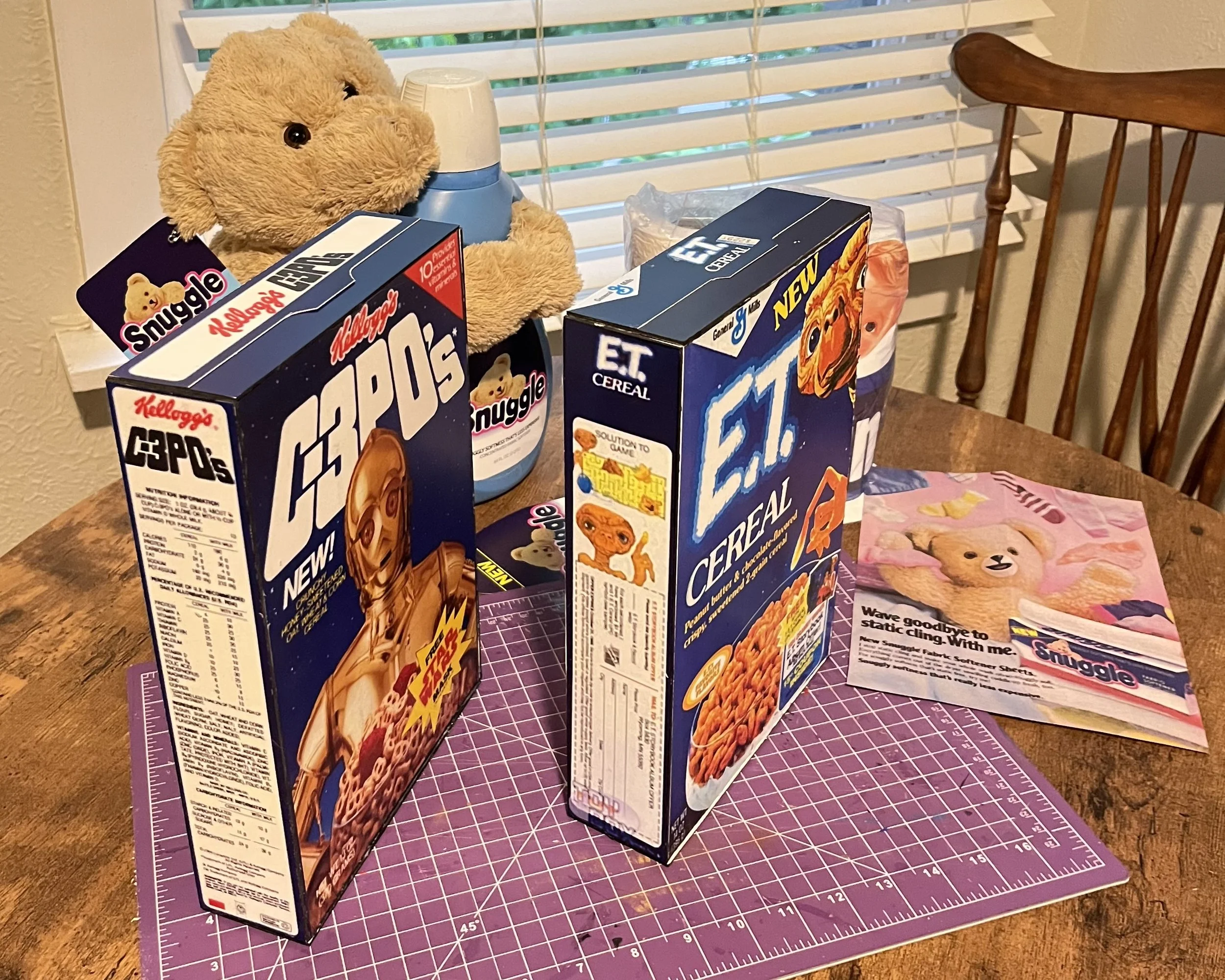 1980s faux cereal boxes and Snuggle bottle.
