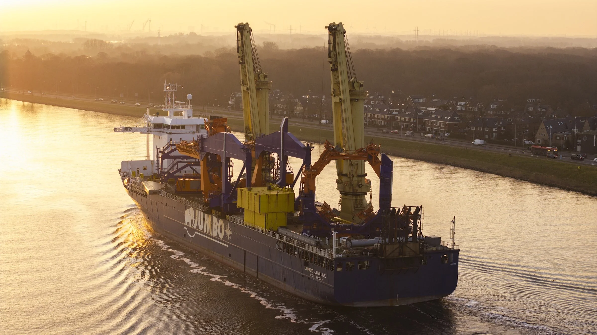 Heavy-lift cargo operations Jumbo Jubilee TMA Terminal Amsterdam IJmuiden. Multi-ton offloading sequences documented through drone operations film production photography Netherlands.