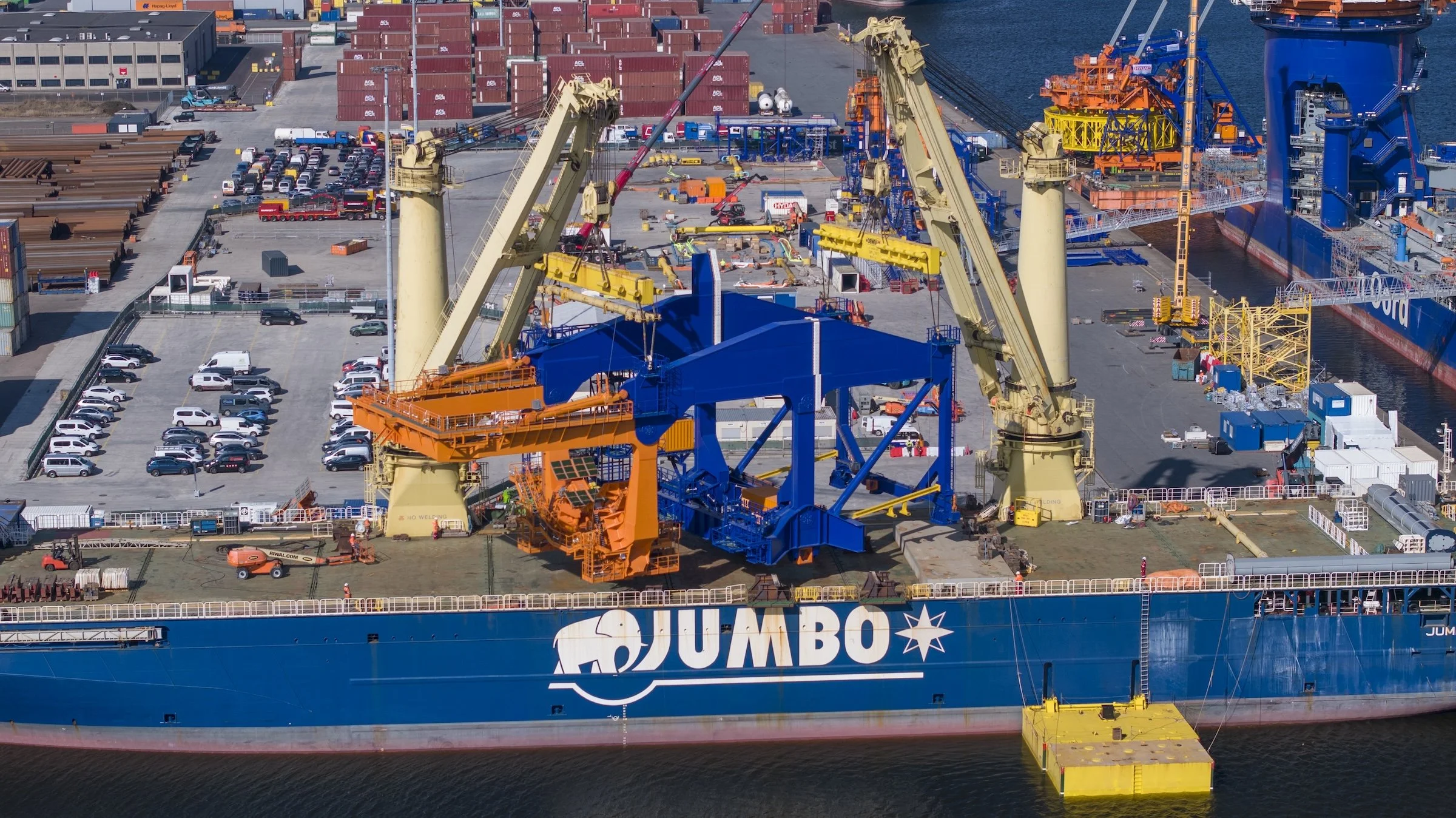 Heavy-lift vessel operations Port of Amsterdam Jumbo Maritime documentation. Specialized cargo handling coordinated within Schiphol controlled airspace active terminal environment Netherlands.