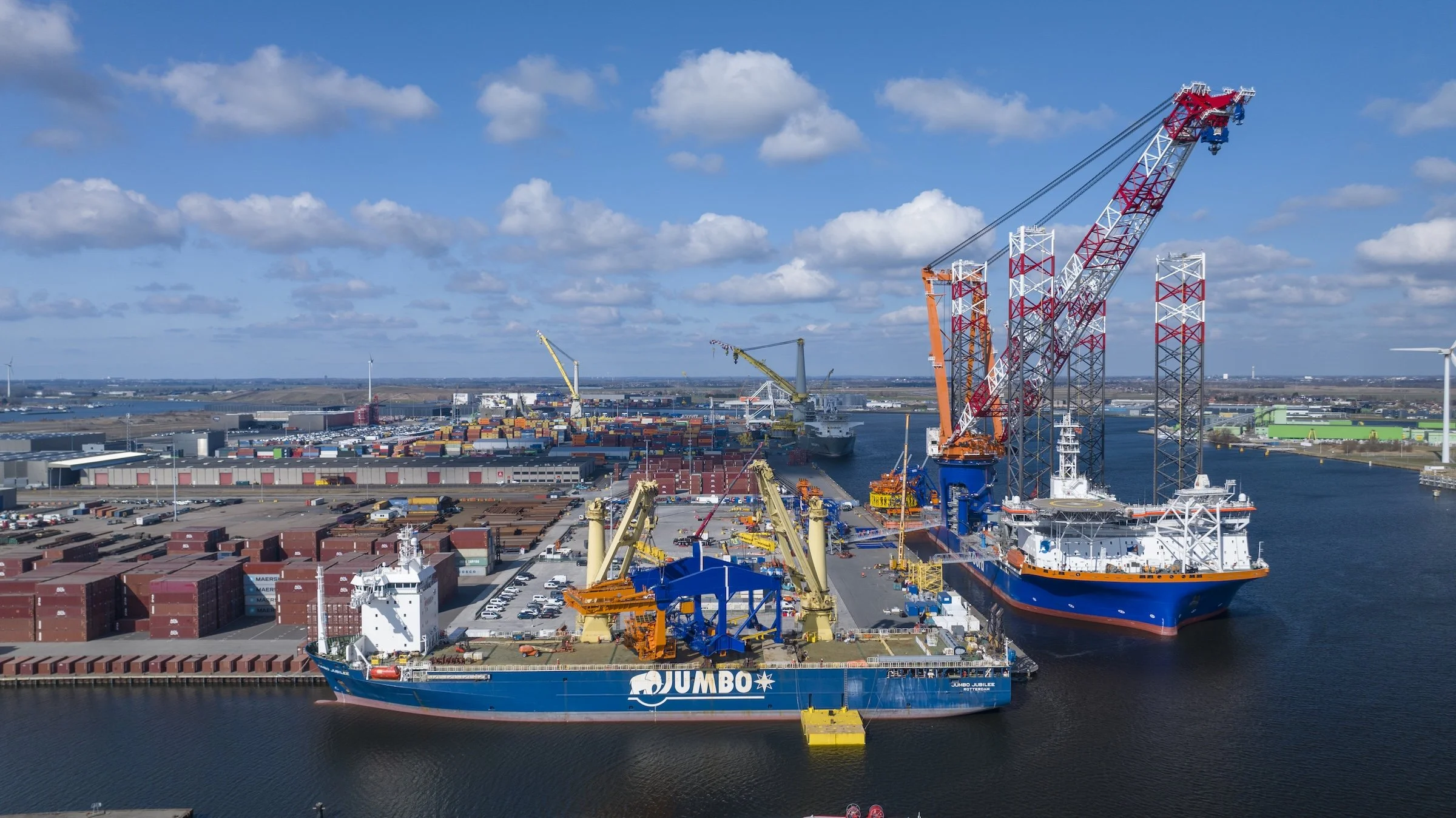 Jumbo Maritime vessel cargo handling Port of Amsterdam Netherlands. Professional photography documenting heavy-lift operations crane coordination terminal logistics three-day operation.