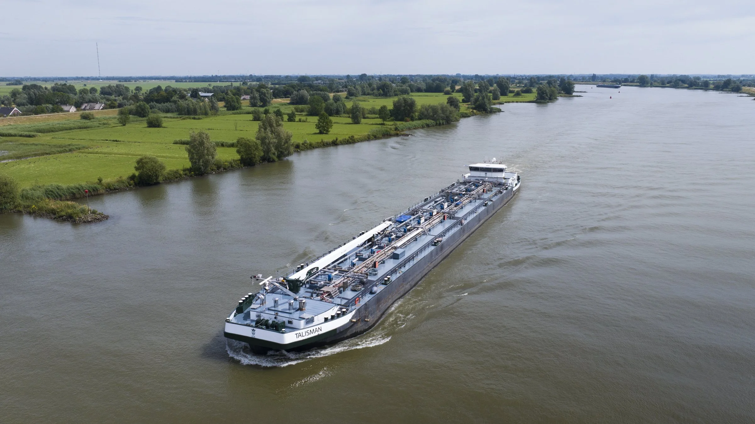 Inland shipping barge fleet Rhine Waal Maas rivers Netherlands waterways tanker operations drone photography documentation