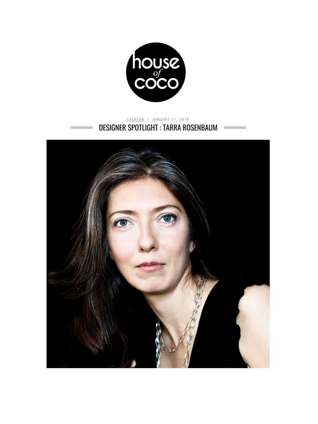 Magazine cover featuring a woman with long brown hair and blue eyes, wearing a black top and silver jewelry, against a black background.