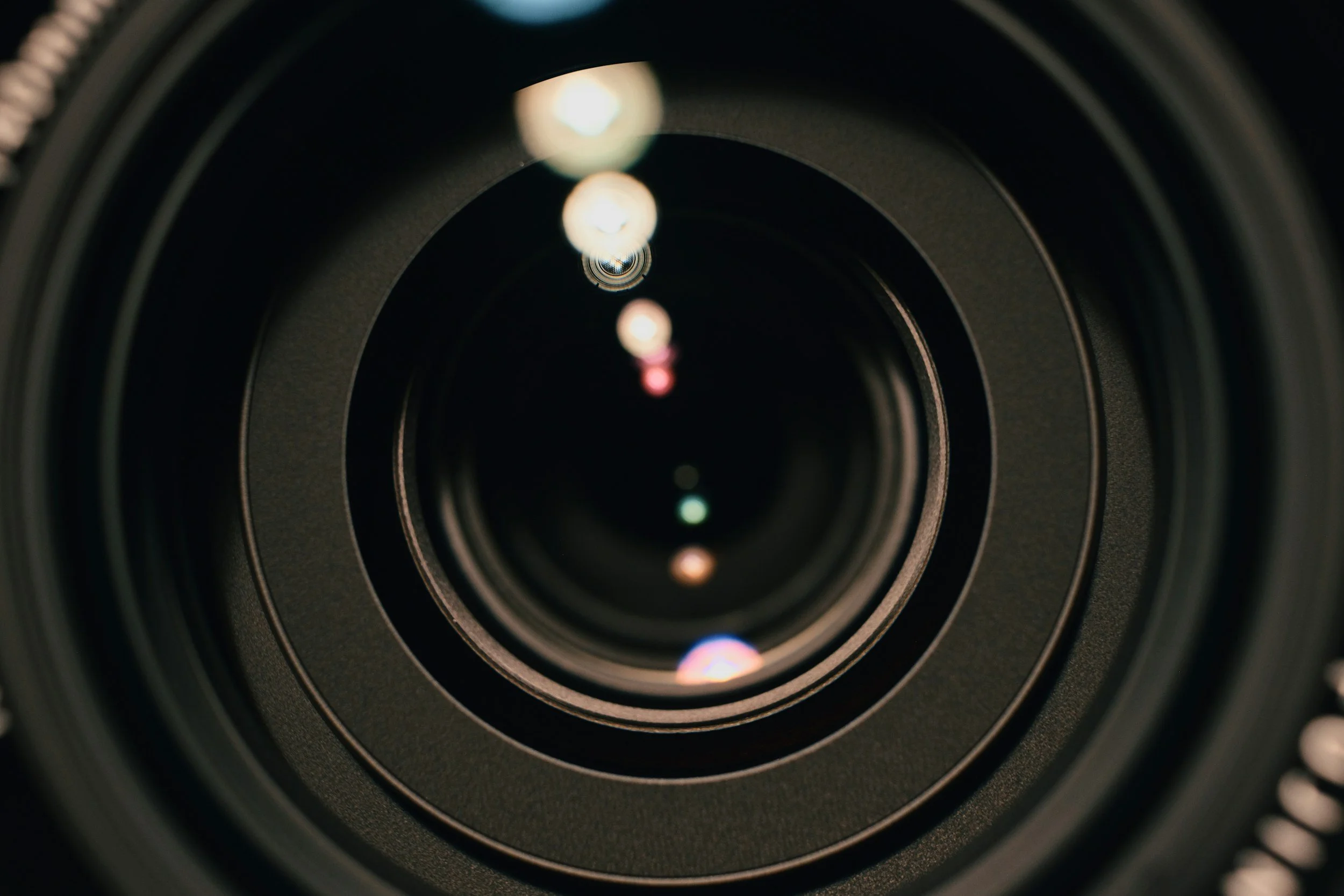 Close-up of a camera lens with reflected light
