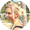 Time to Surf review profile image - A person with blonde hair styled in a ponytail outdoors during daytime.