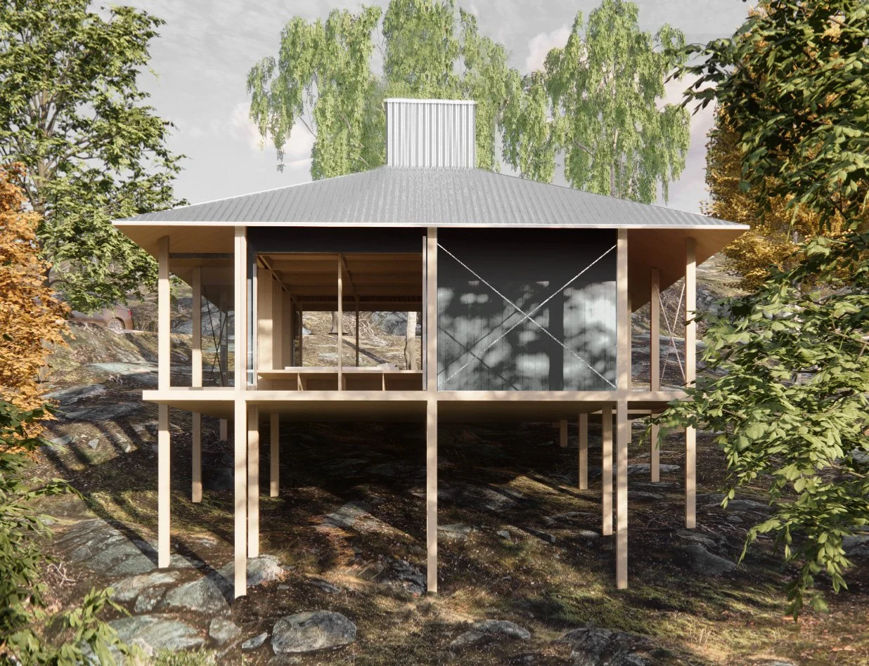 A modern two-story house built on stilts with a metal roof, situated on a rocky, wooded landscape with trees and bushes surrounding it.