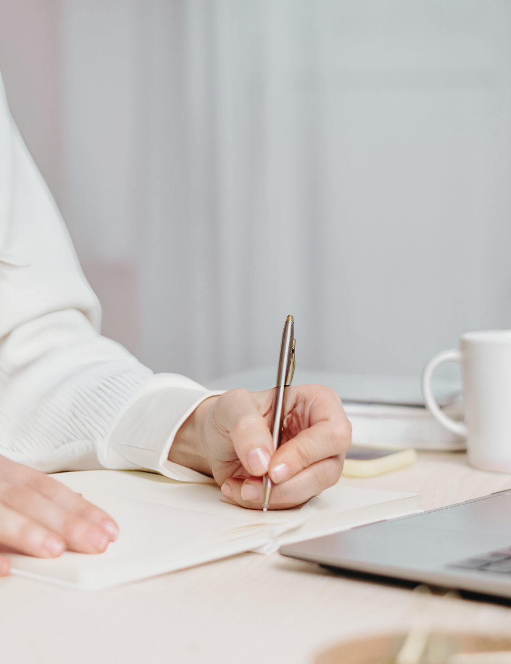 Woman writing in notebook getting things done.