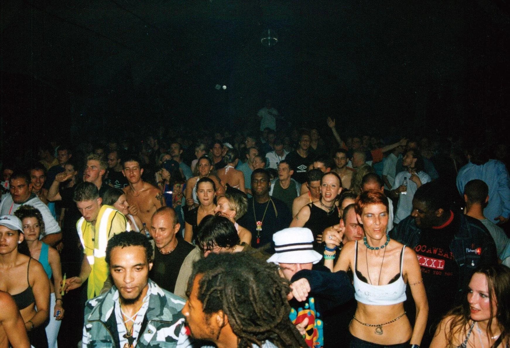 Crowd gathered inside UK underground rave venue during club event