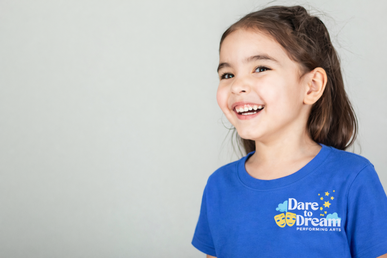 Young girl laughing in blue dare to dream dare to dream performing artstshirt