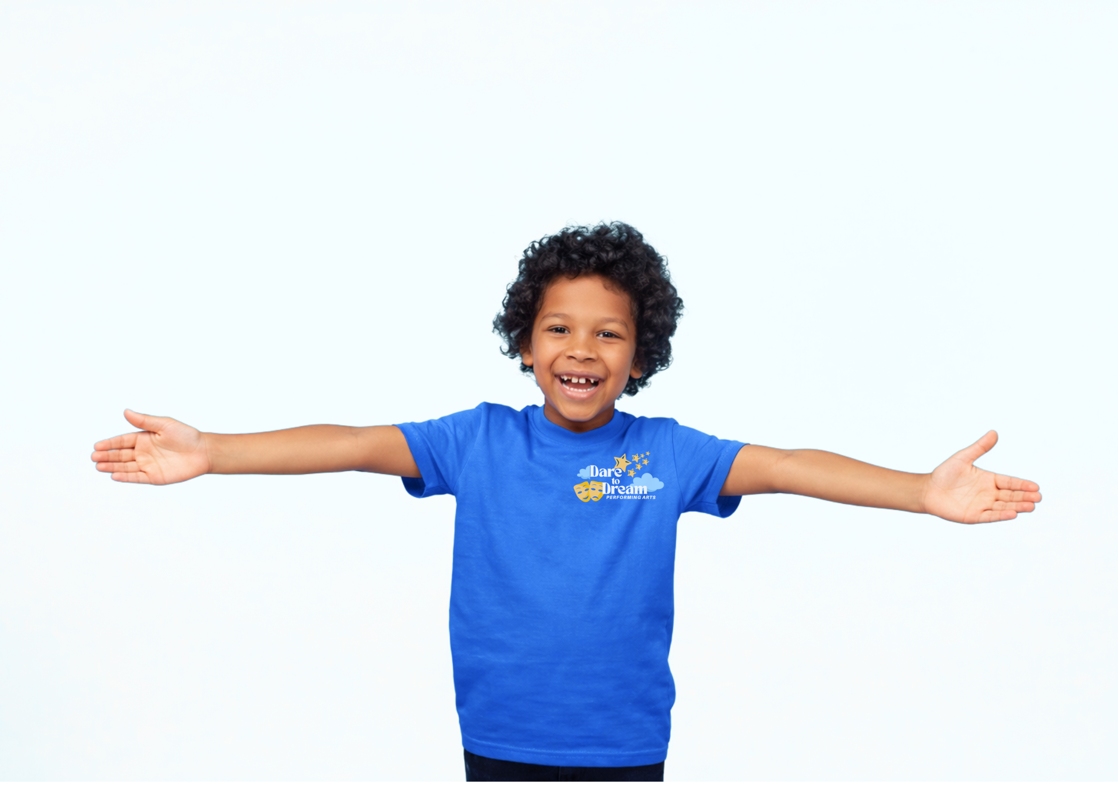 Young boy smiling with ope arms in blue dare to dream performing arts tshirt