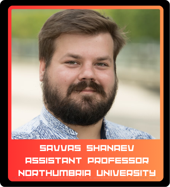 Photograph of Savvas Shanaev smiling outdoors, with a blurred background, wearing a blue patterned shirt, identified as an assistant professor at Northumbria University.