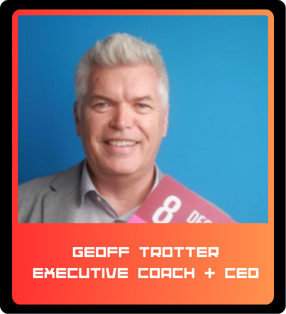 A smiling man with gray hair wearing a gray suit jacket over a light collared shirt, holding an 8 on a pink card against a blue background. The card has the date 8 DEC on it. A red border surrounds the image with a gradient from red to orange at the 