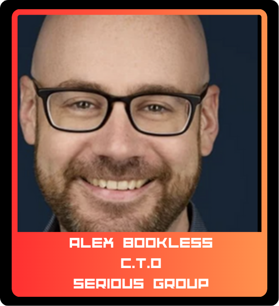 Photo of a smiling man wearing glasses, with a beard and short hair, against a dark background. Text overlay reads: "Alex Bookless, C.T.O, Serious Group".