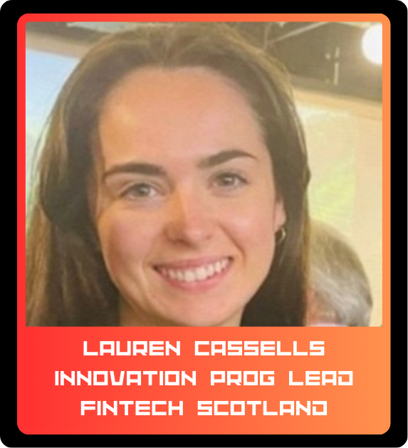 A young woman with dark hair and a bright smile, wearing a hoop earring, in an indoor setting with blurred background.