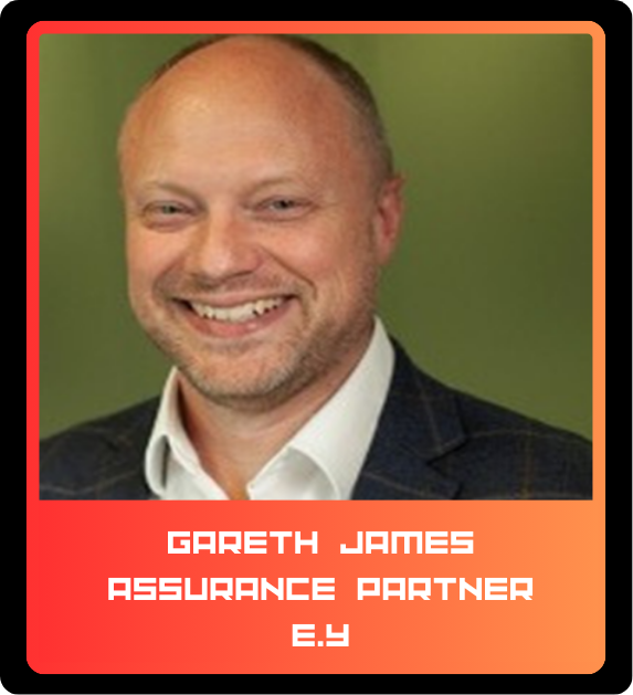 A man with a broad smile, short hair, and a goatee, wearing a dark blazer and a white shirt, standing against a green background. The card below his photo reads "Gareth James, Assurance Partner, E.Y.".