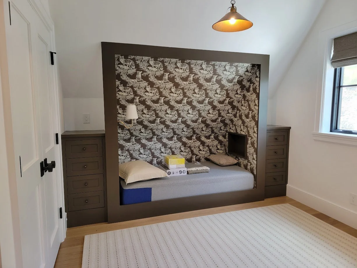 Additional built-in bed designed for guest accommodations, maintaining consistency in materials and detailing.