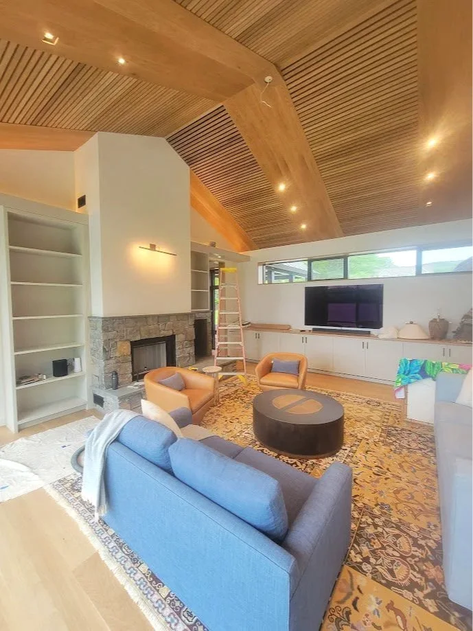Great room built-ins and ceiling detailing designed as a unified architectural composition.
