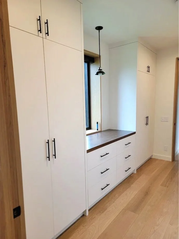 Custom primary closet millwork tailored for organization, flow, and efficient use of space.