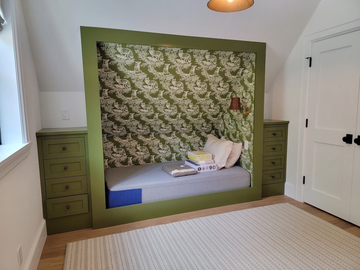 Sleeping built-ins designed to support flexible use while reinforcing the home’s warm, transitional character.