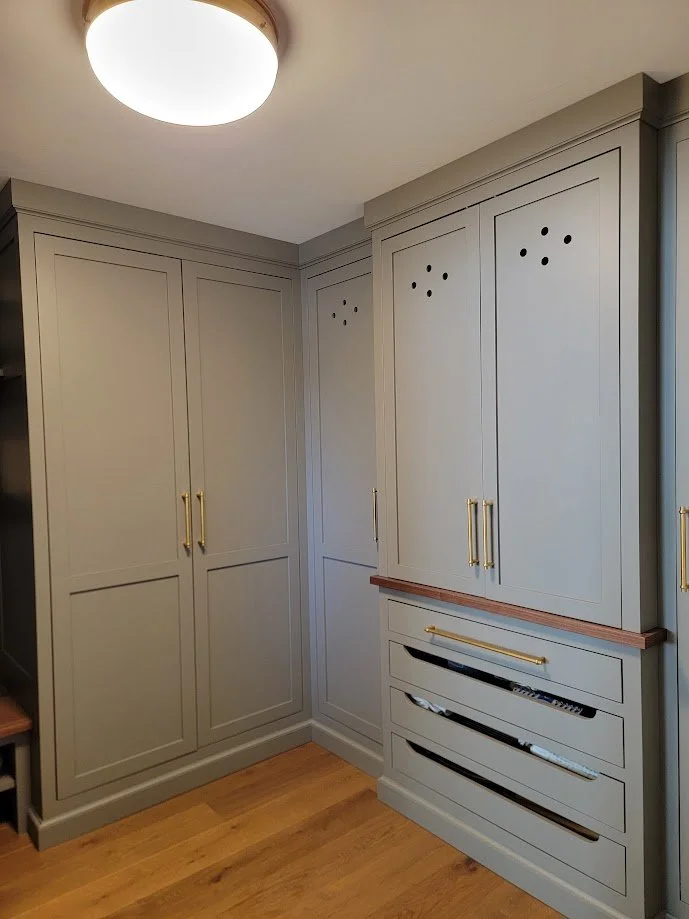 Custom mudroom built-ins with integrated storage, bench seating, and durable millwork designed for a high-traffic resort home.