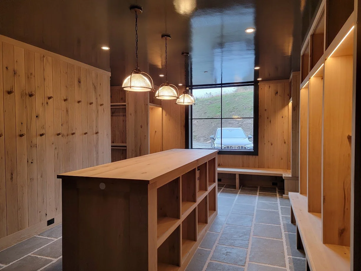 Mudroom built-ins designed for ski-season use, balancing durable storage with a clean, transitional aesthetic.