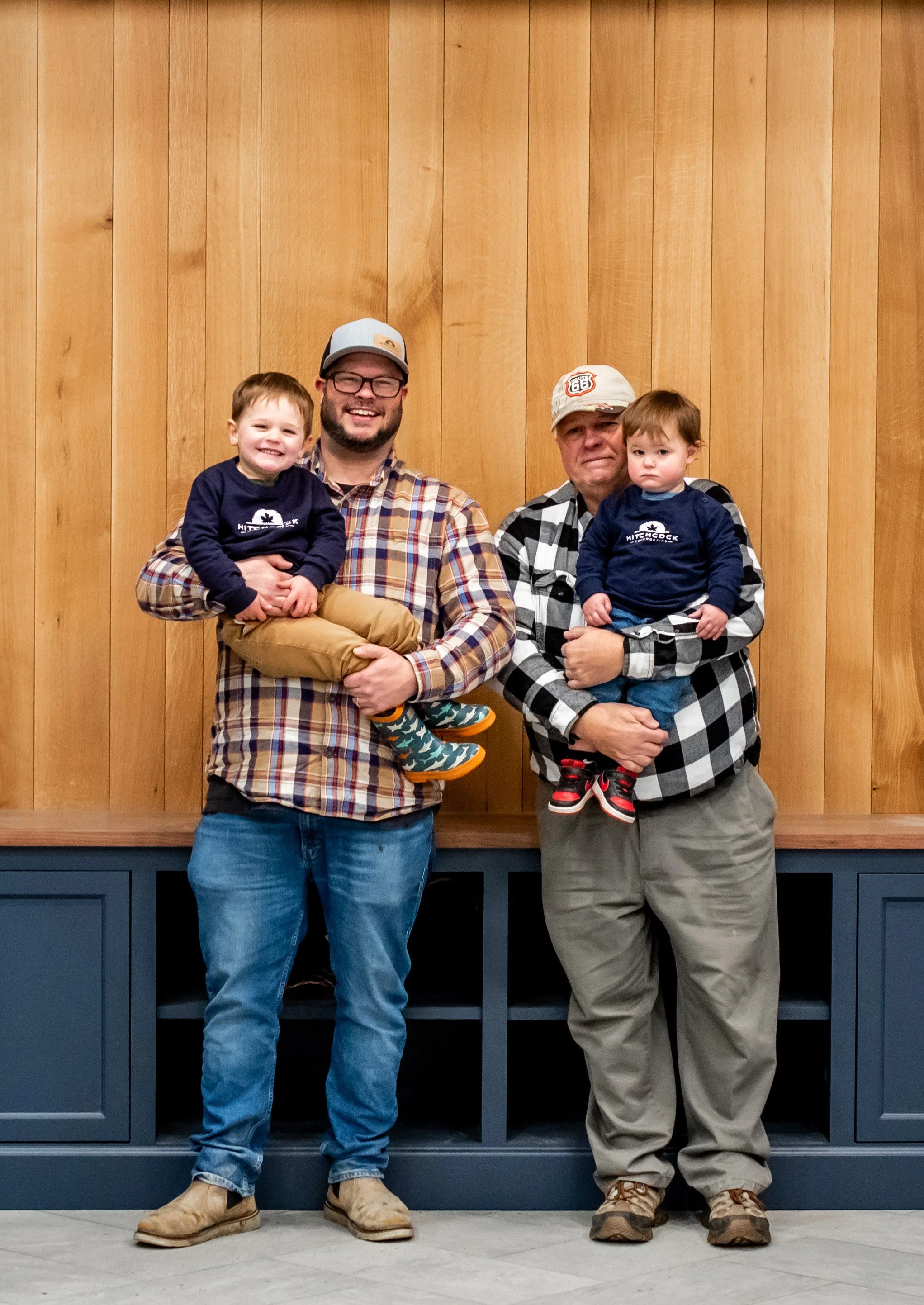 Three generations of the Hitchcock Woodworking family, representing the legacy and continuity behind the business