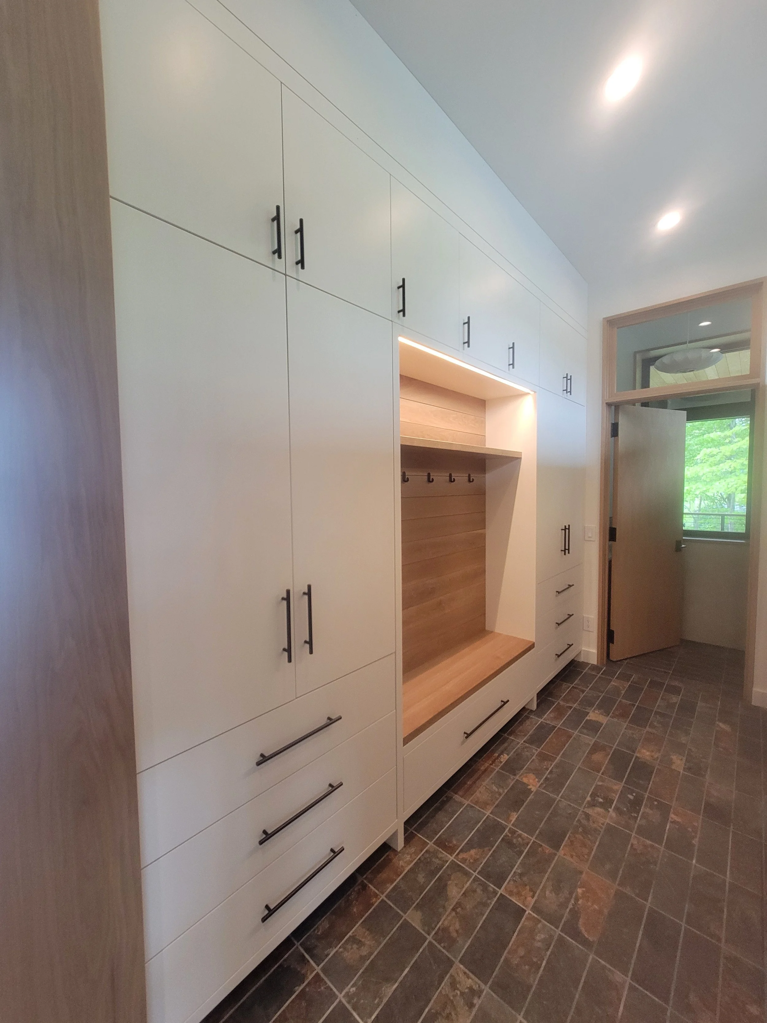 Integrated mudroom cabinetry with balanced proportions and materials consistent with the rest of the home.