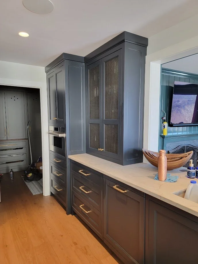 Custom millwork defining the transition into the kitchen, with integrated trim and architectural detailing.